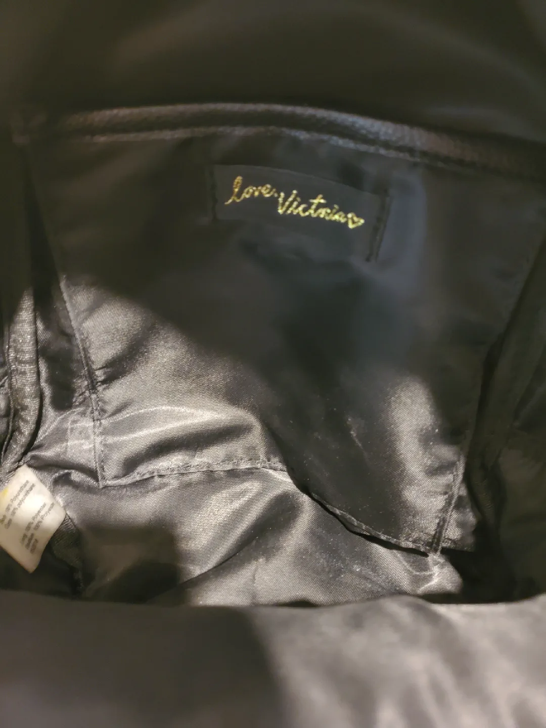 Victorias Secret black mini backpack with gold-like chain accent image indicator(10)