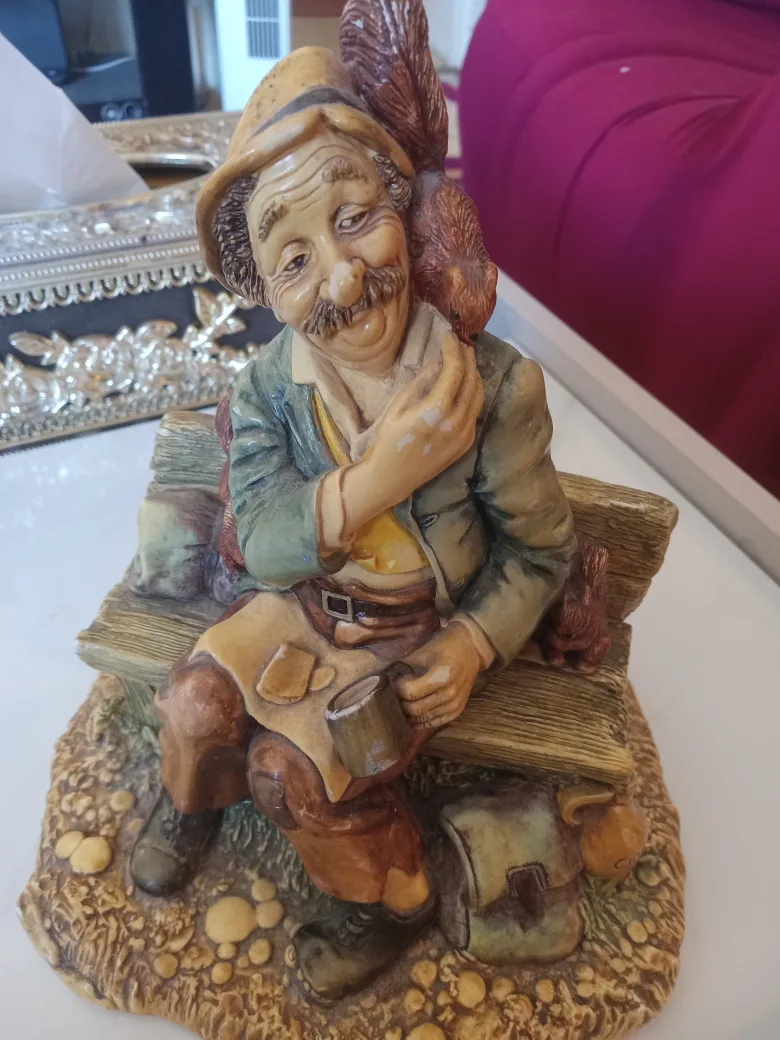 Vintage Figurine of Man with Squirrels thumbnail