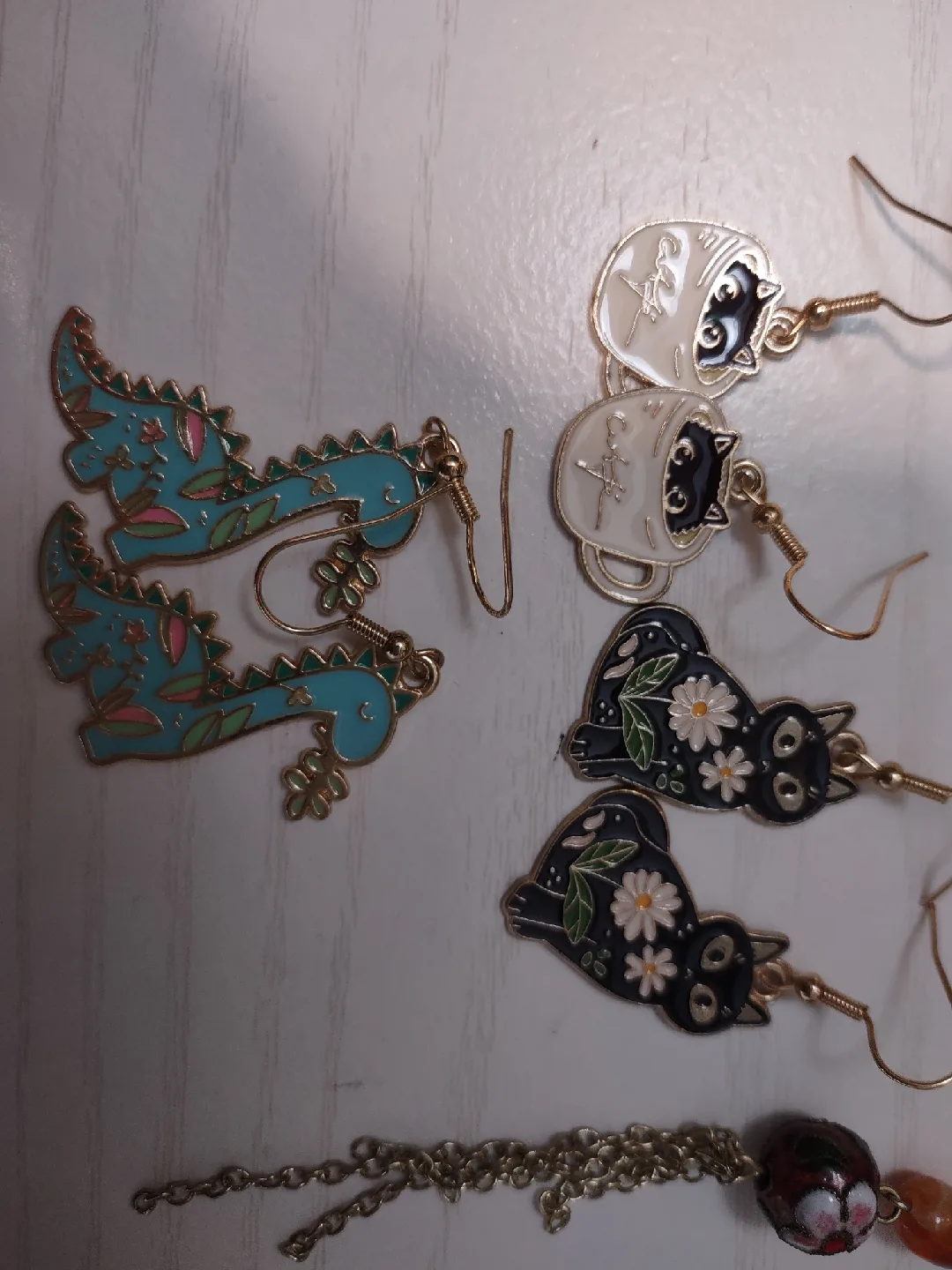 Assorted Earrings - Hoops, Cats, Dragons image indicator(2)