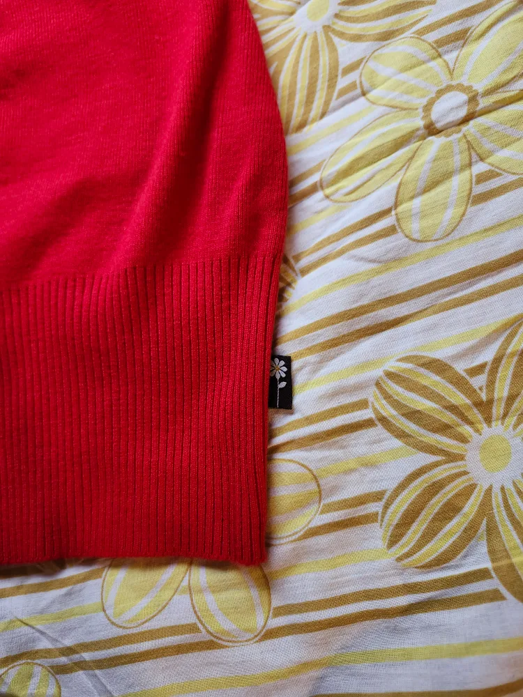 Red and black Bum Warmer mini sweater skirt with flower detail image indicator(4)