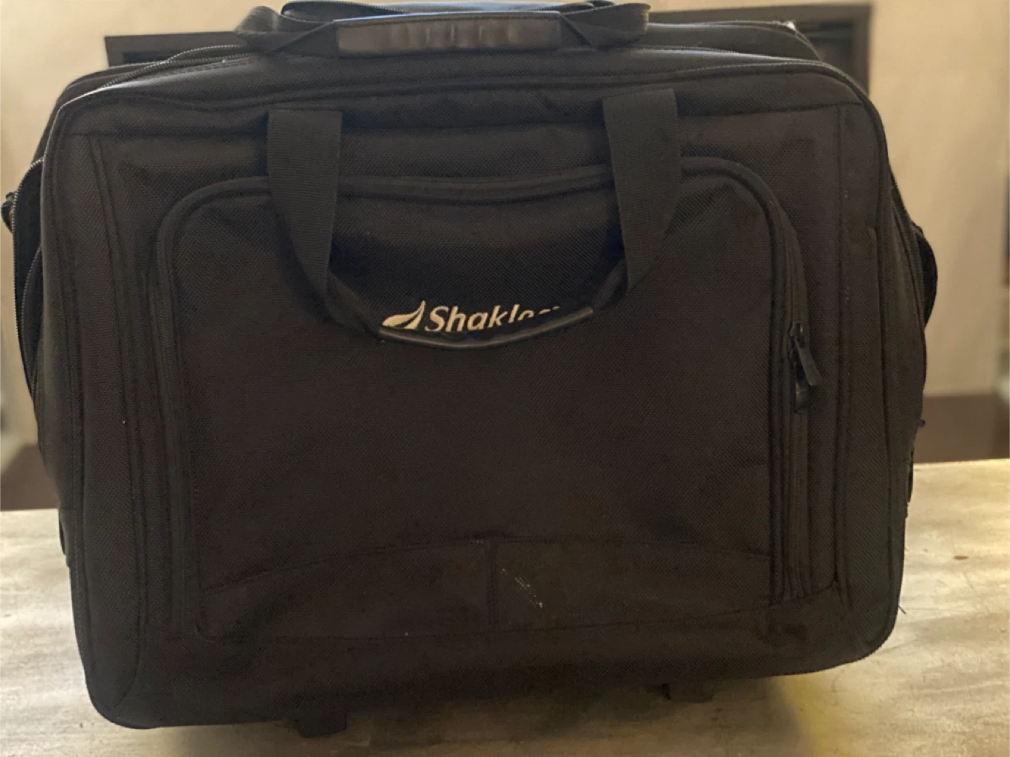 Shaklee Black Rolling Carry-On Bag