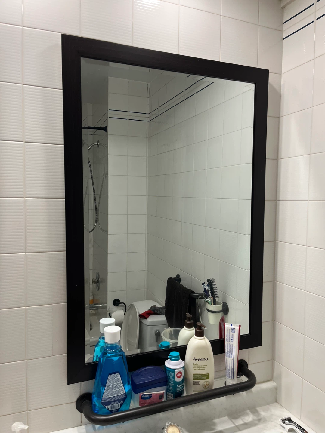 Bathroom mirror with black frame