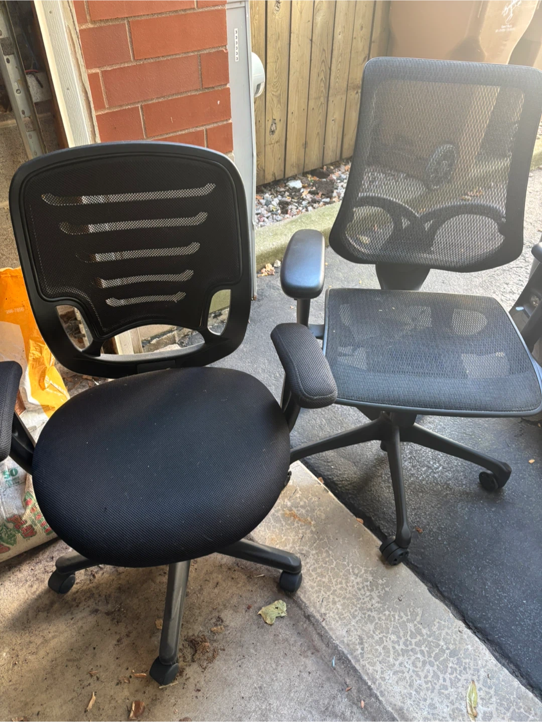 Two Black Mesh Office Chairs