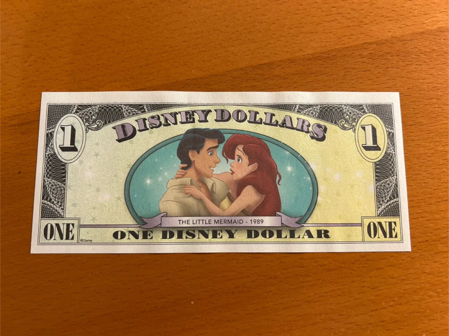 2011 series. $1 Disney Dollars. Little Mermaid. Disney World. thumbnail