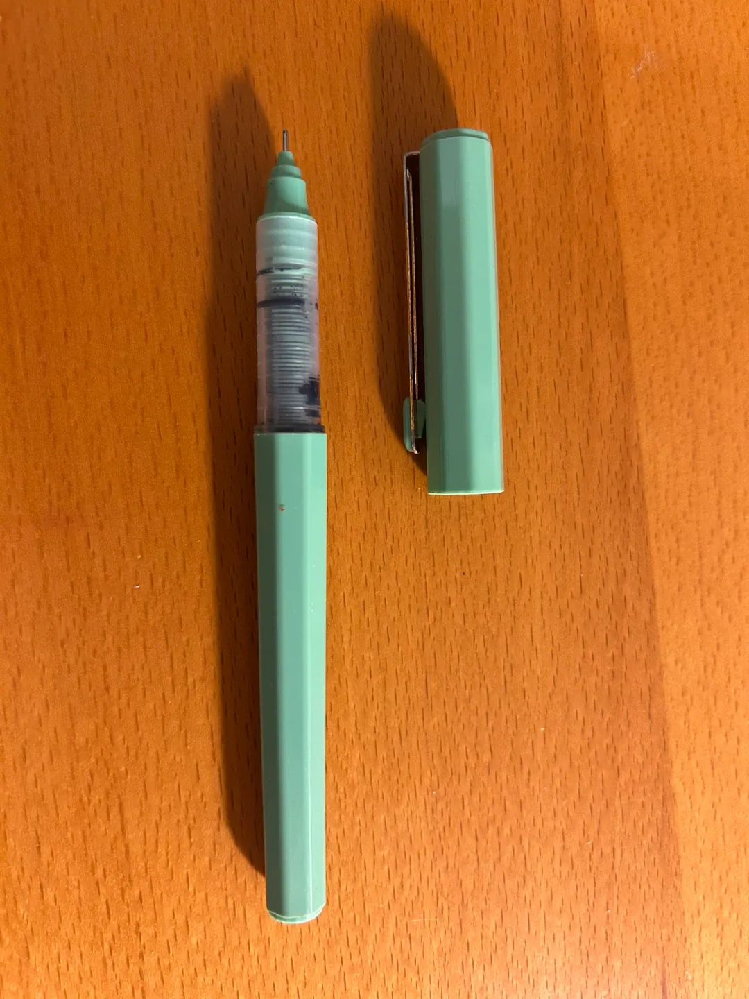 Black ink pen with green body thumbnail