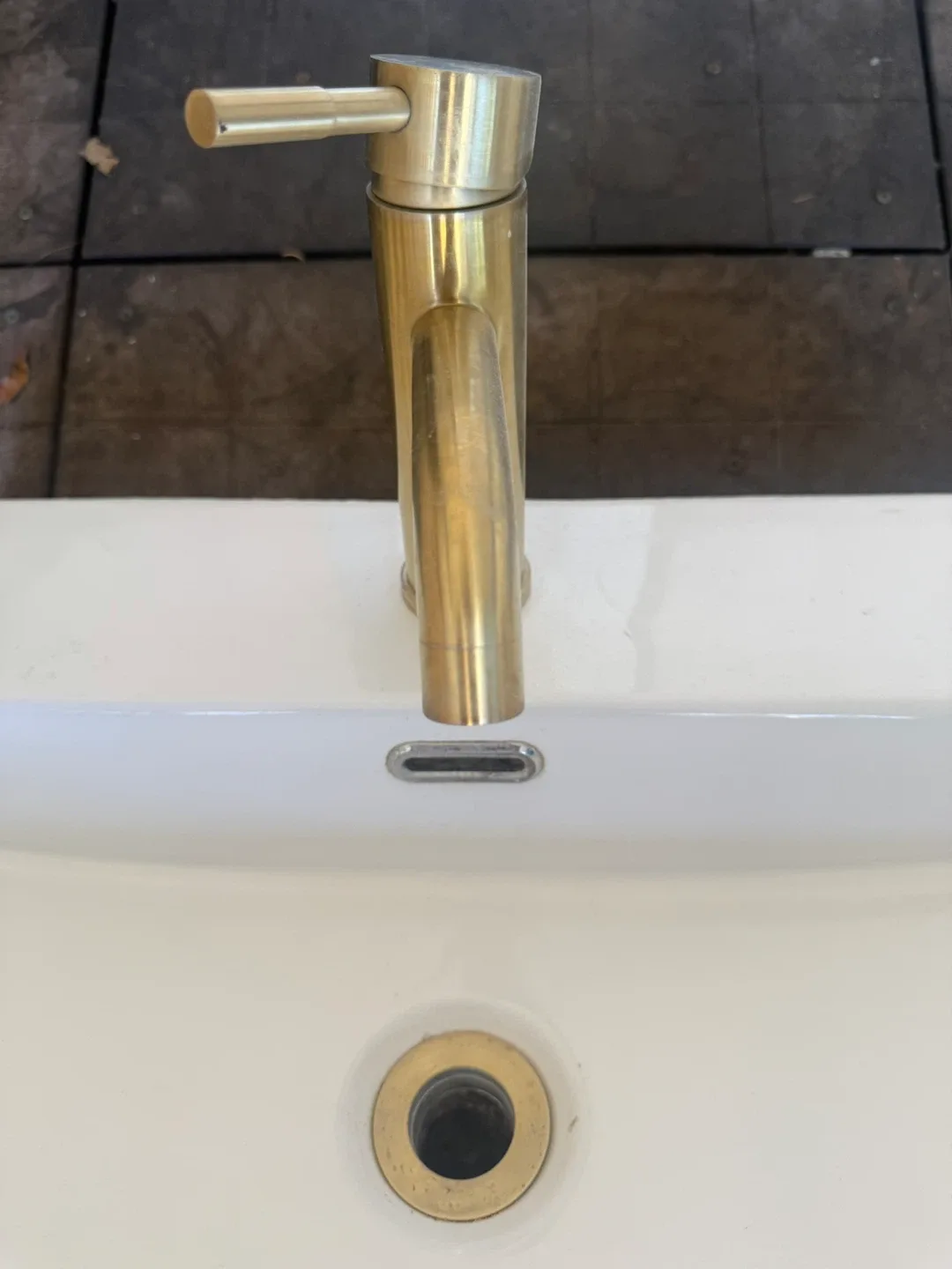 Bathroom Sink with Gold Faucet image indicator(5)