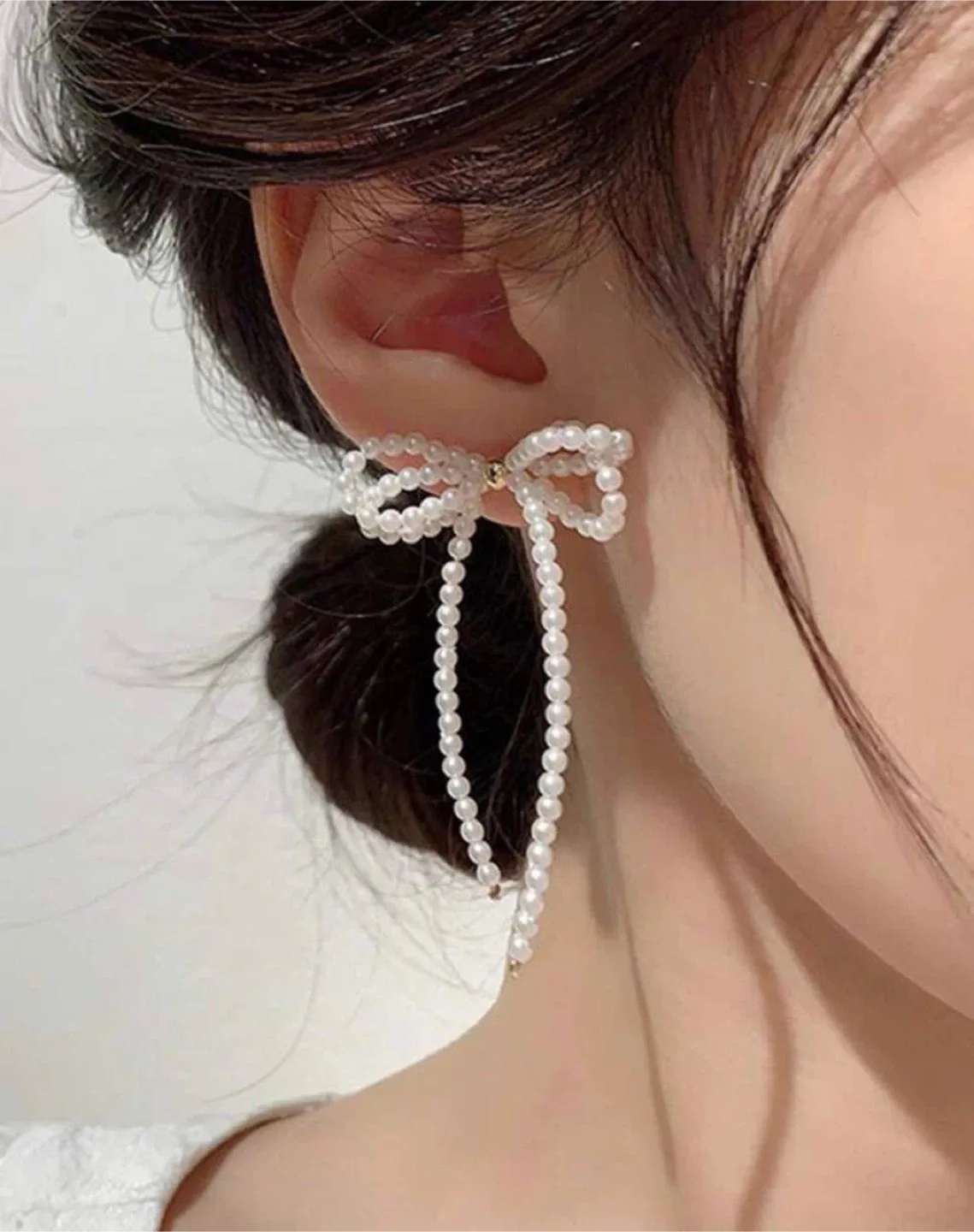 Bow & faux pearl earrings thumbnail
