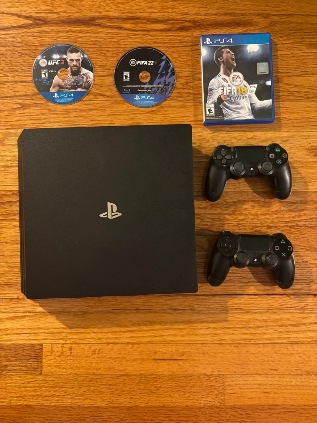PlayStation 4 with Games and Controllers