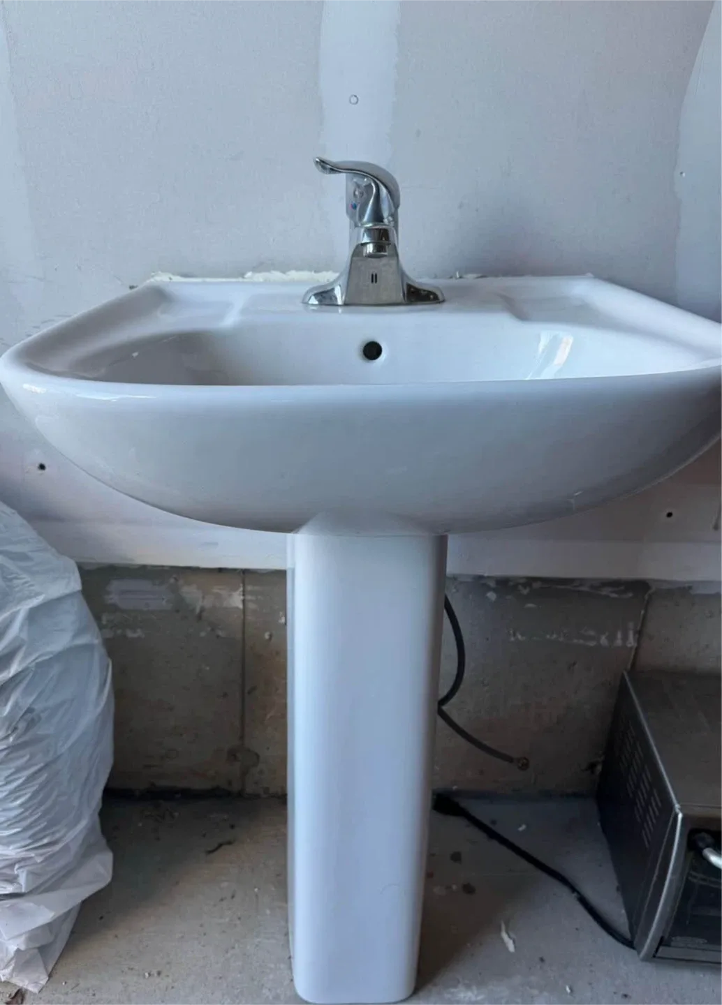 White Pedestal Sink with faucet