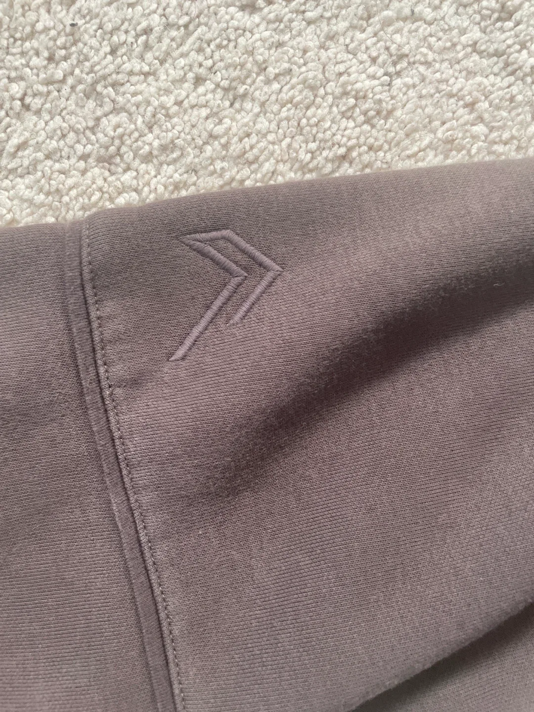 Brown hoodie says oner active image indicator(3)