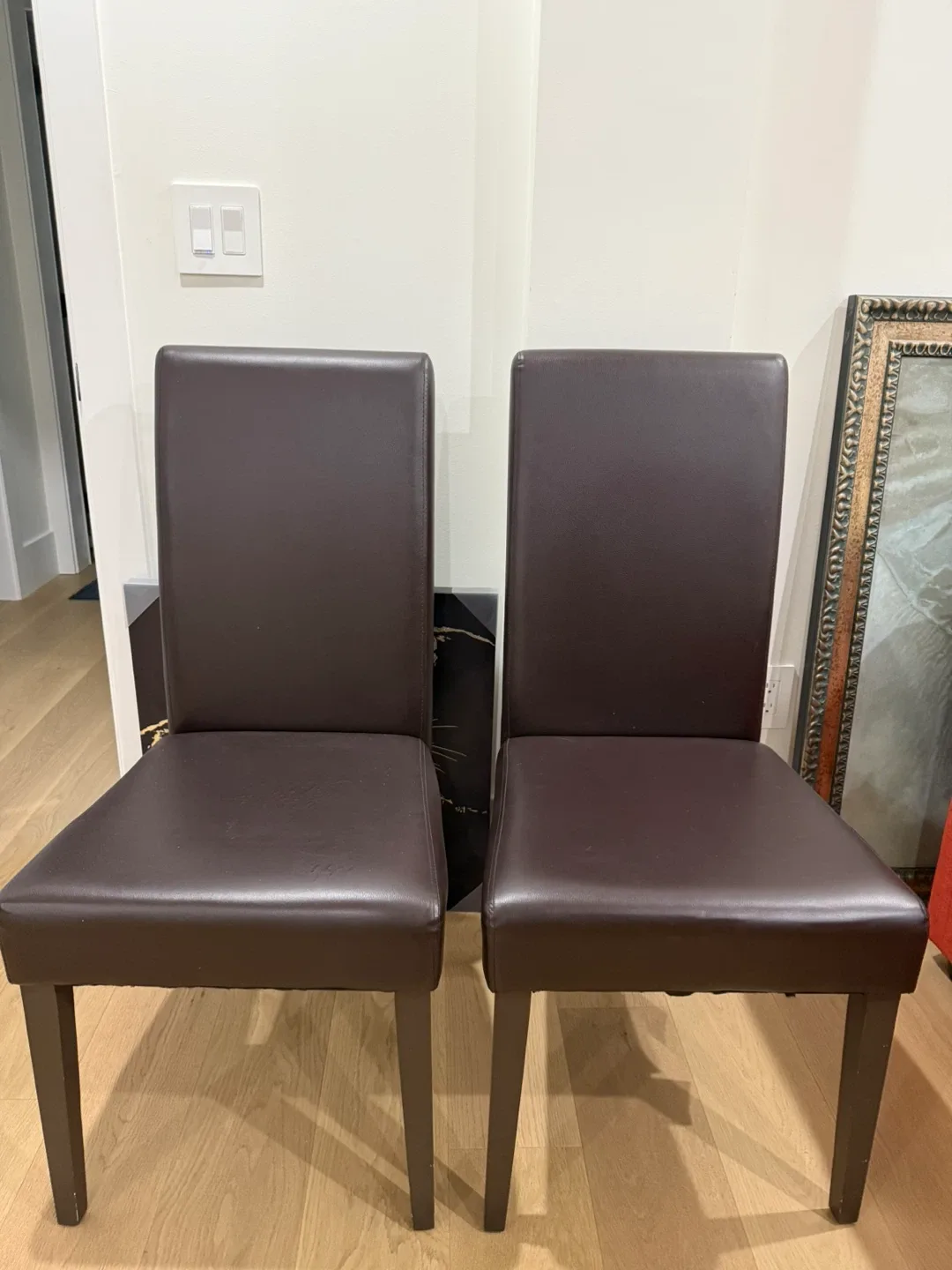 Two Dark Brown Leather Dining Chairs ($10 each) image indicator(2)