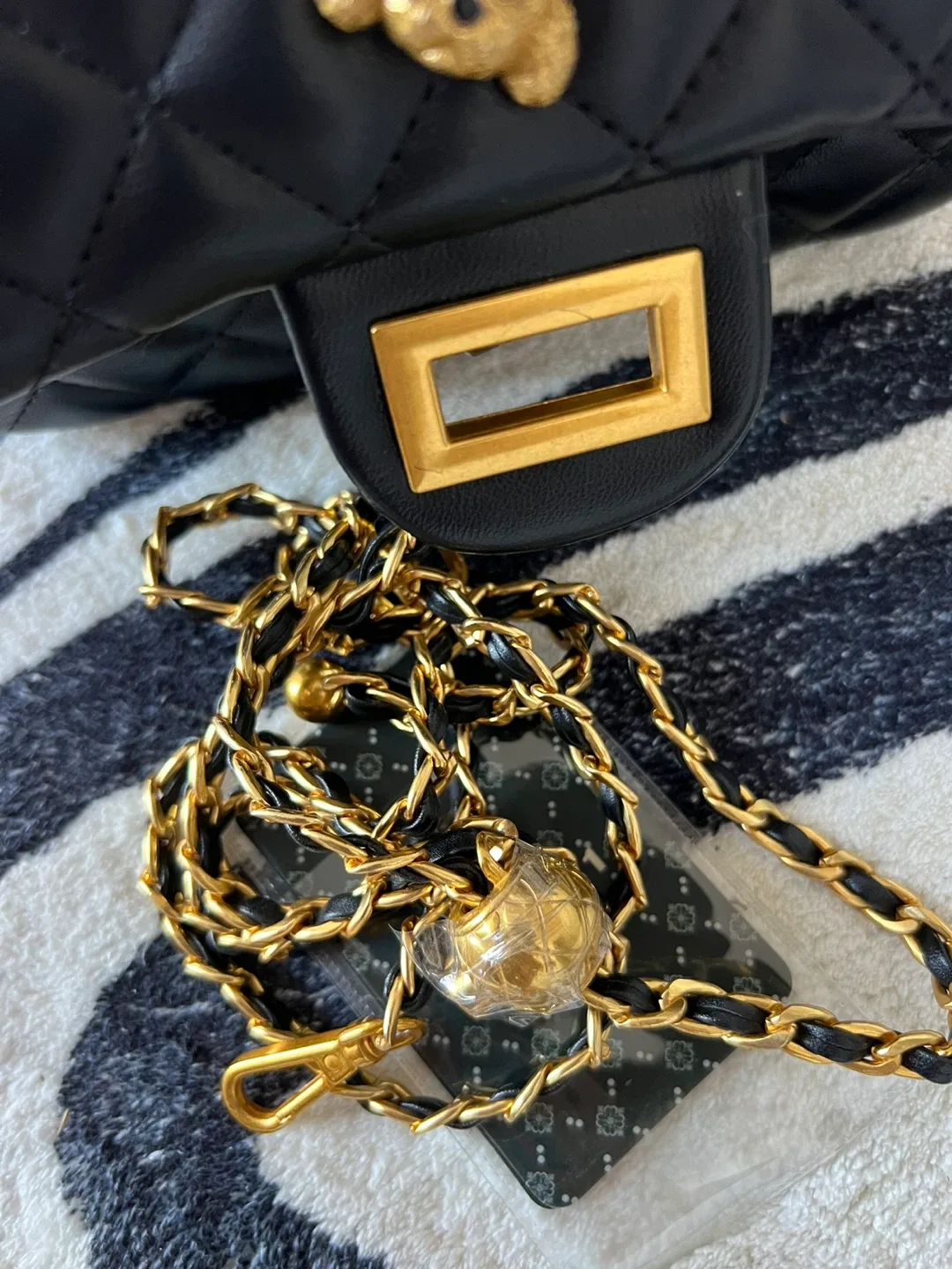 Black Quilted Handbag with Gold Accents image indicator(4)