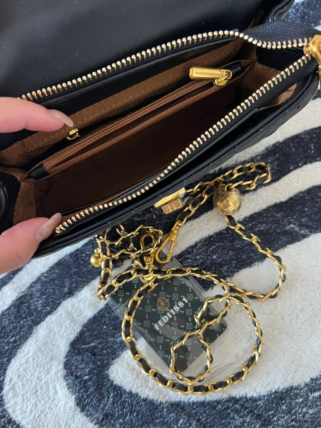 Black Quilted Handbag with Gold Accents image indicator(3)