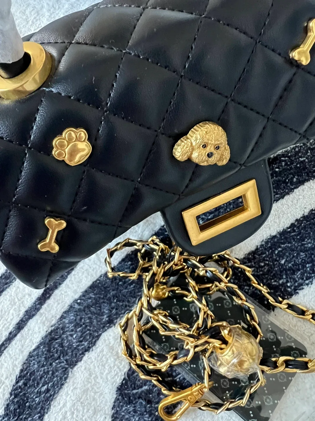 Black Quilted Handbag with Gold Accents image indicator(5)