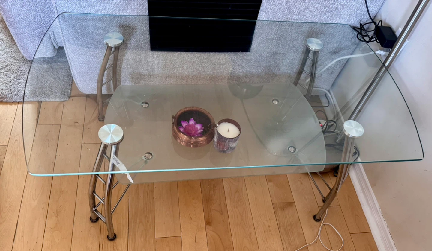 Glass coffee table with lower shelf , very sturdy