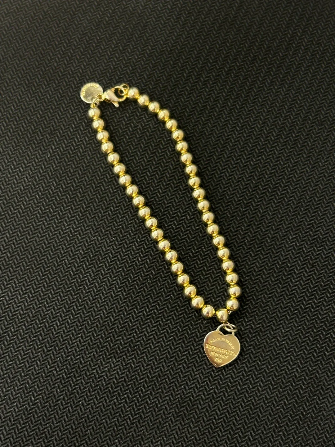 Tiffany & Co. Gold Bead Heart Tag Bracelet image indicator(5)