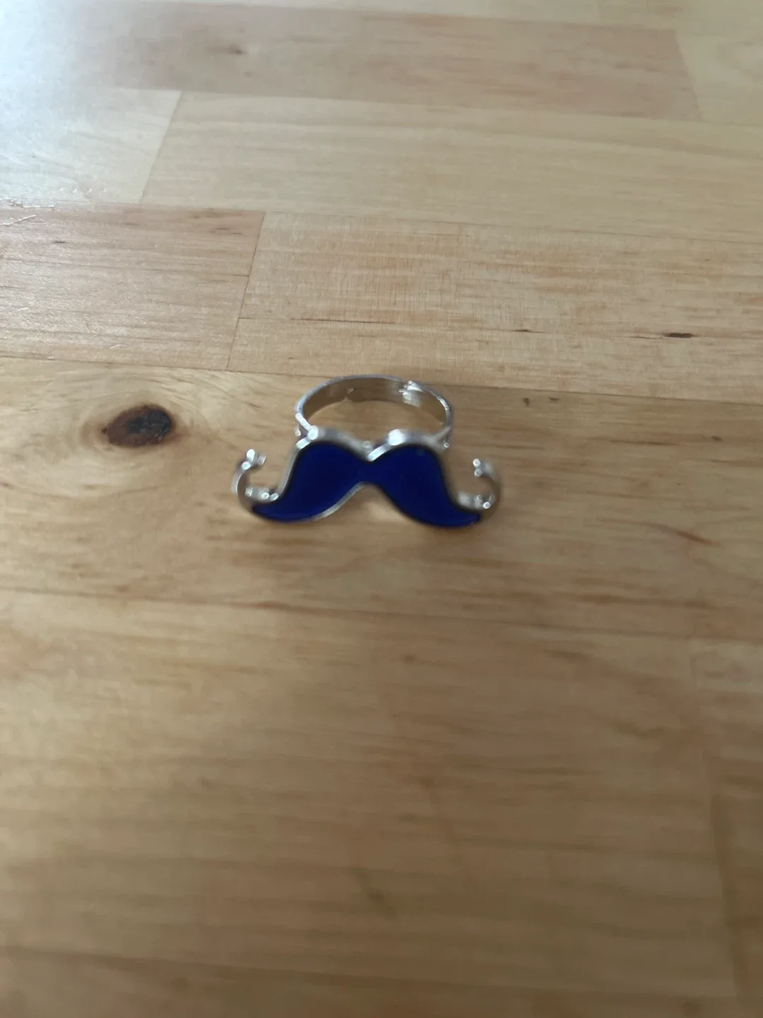 Adjustable moustache mood ring image indicator(2)