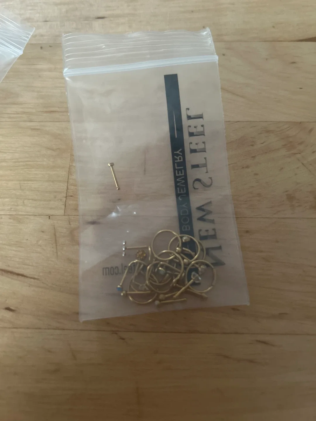 Assorted Gold Nose Rings and studs image indicator(2)