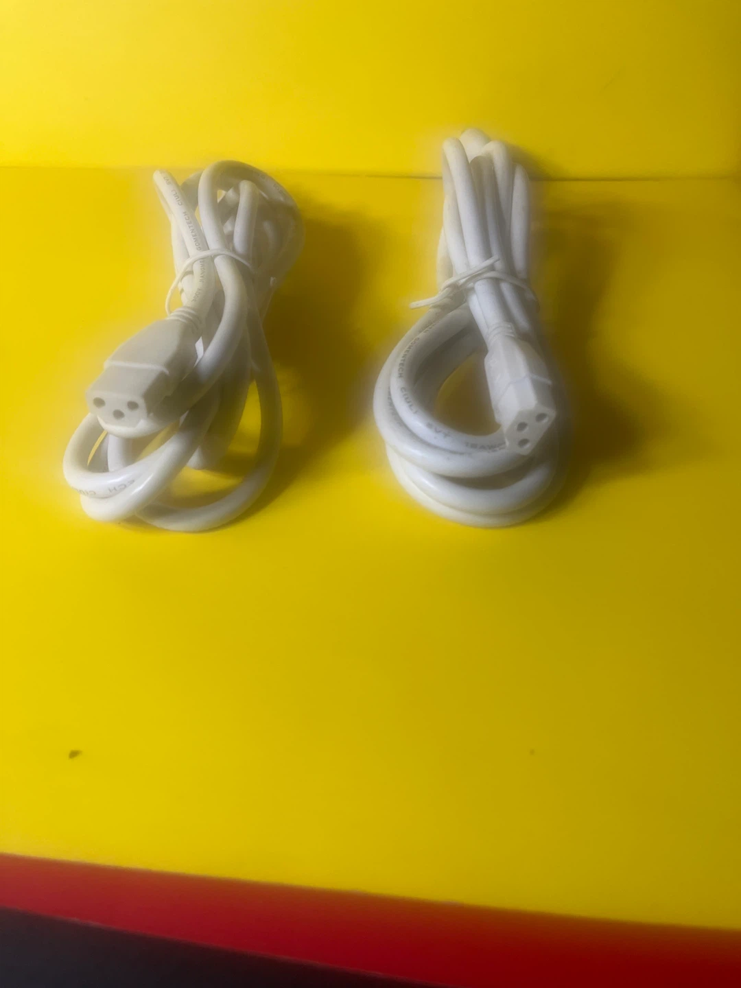 Two White Power Cords