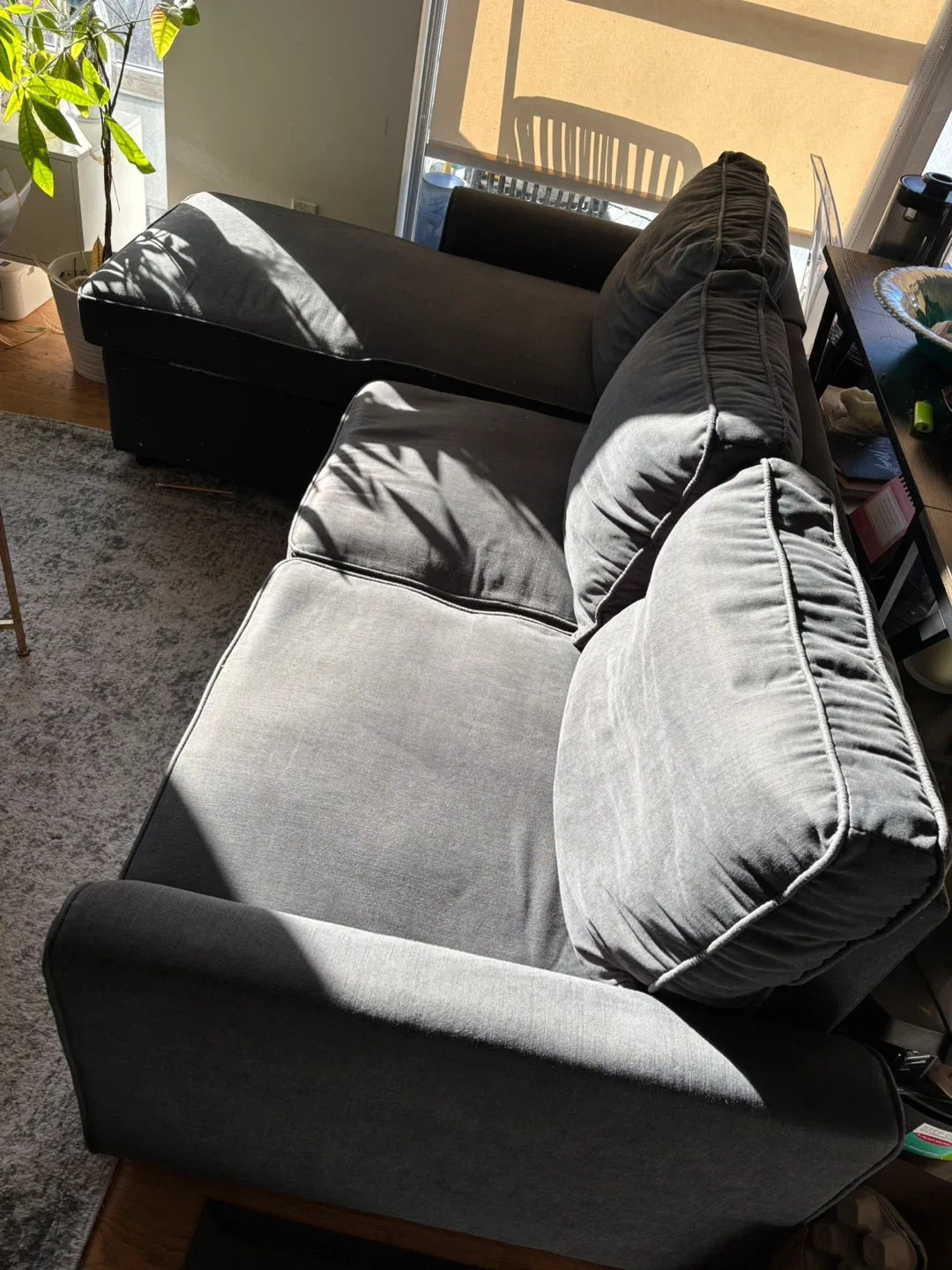 Dark grey pull out sectional couch with storage and sofa bed