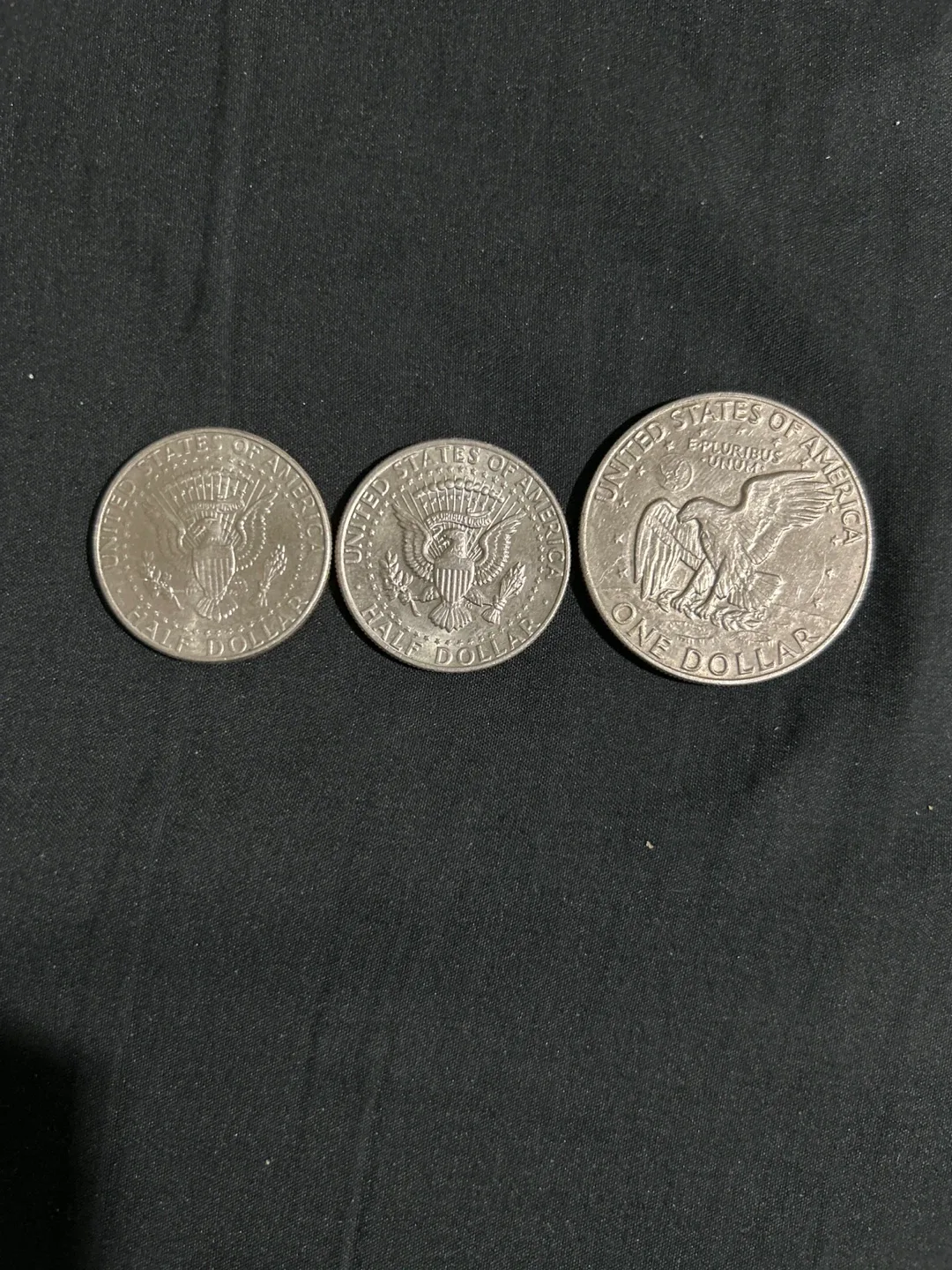 Monedas 1974 1 dólar y medio dólar image indicator(2)