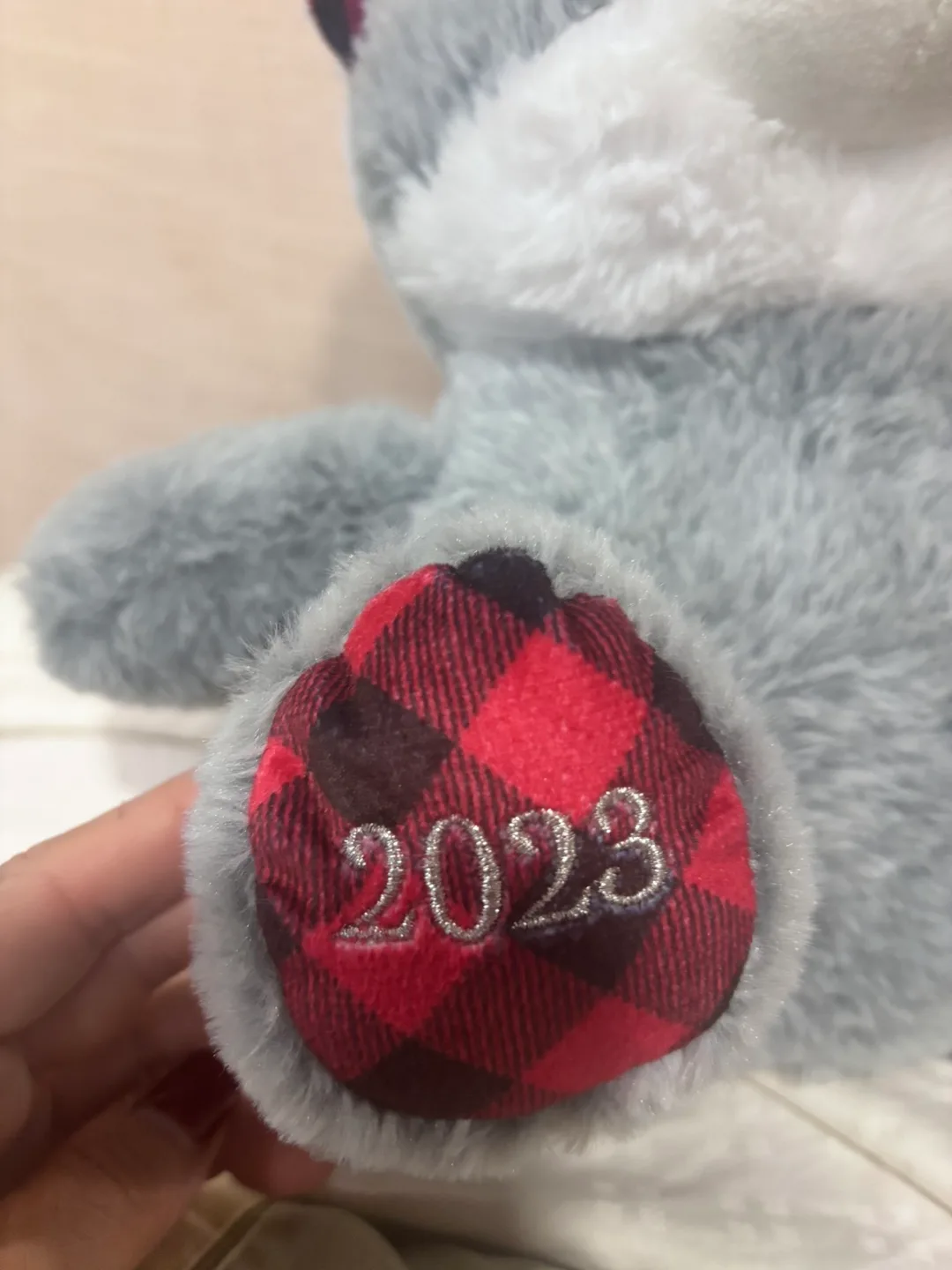 Gray Plush Animal with Red Plaid Accents - 2023 image indicator(5)