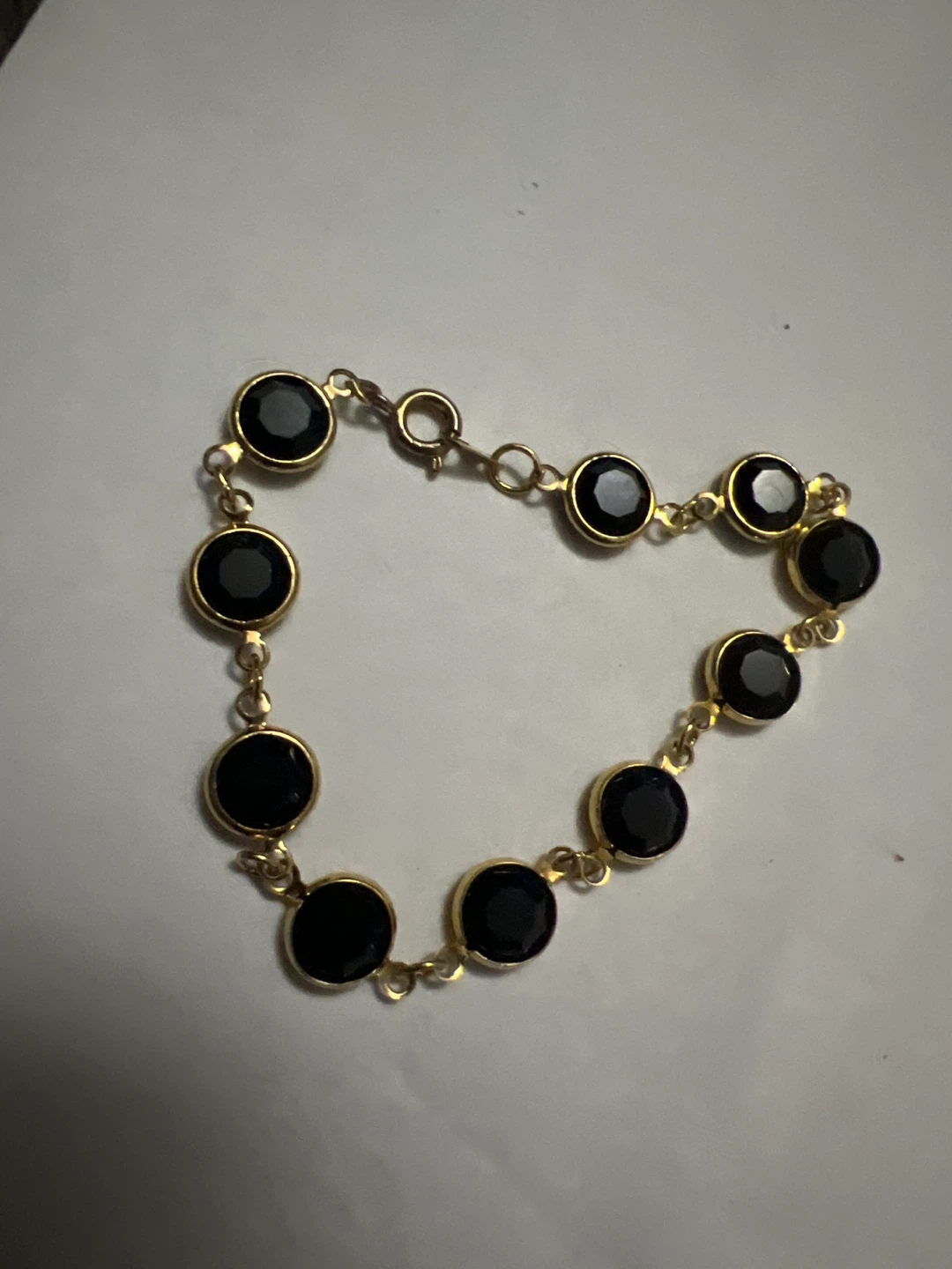 Gold Tone Bracelet with Black Stones