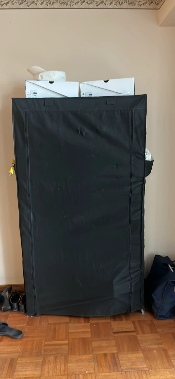 Black shoe rack with zipper that covers