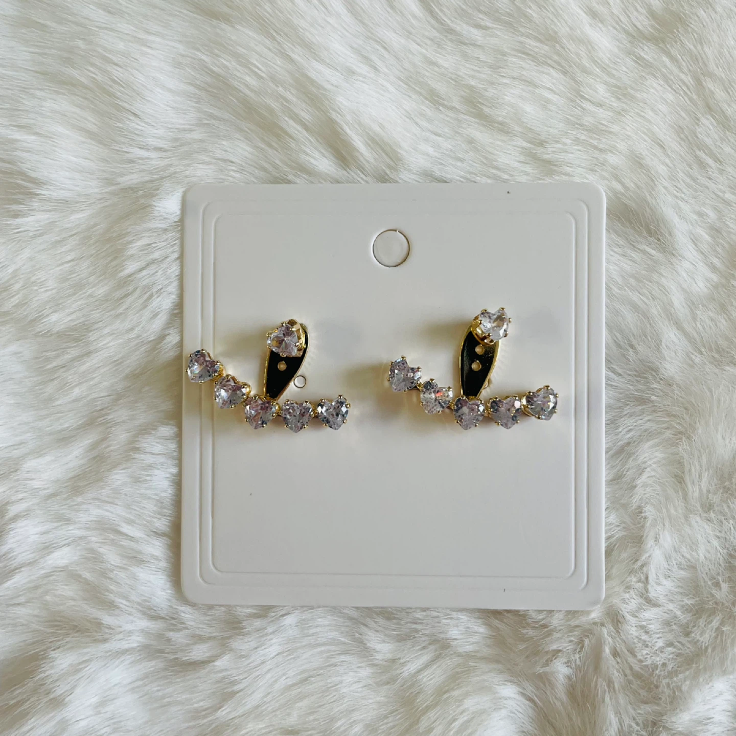 Ear jacket earrings with heart-shaped stones