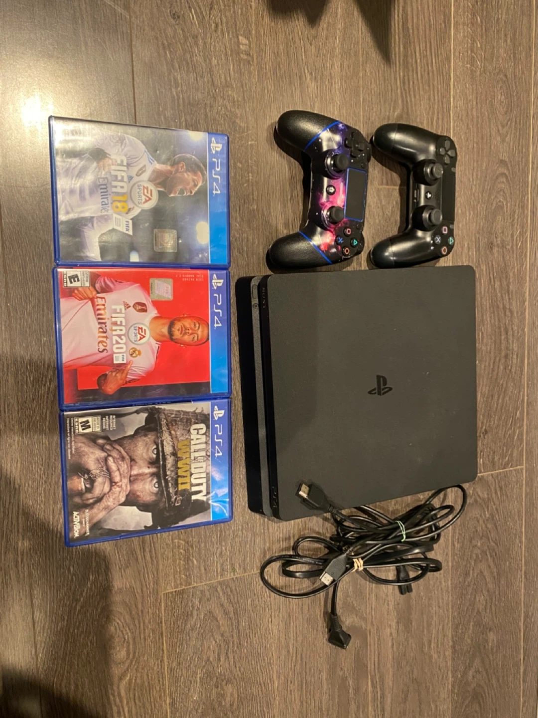PlayStation 4 with Games and Controllers