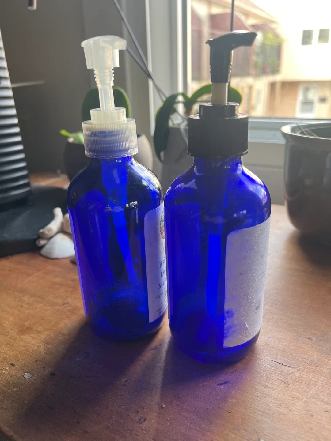 Two Used Cobalt Blue Glass Pump Bottles thumbnail
