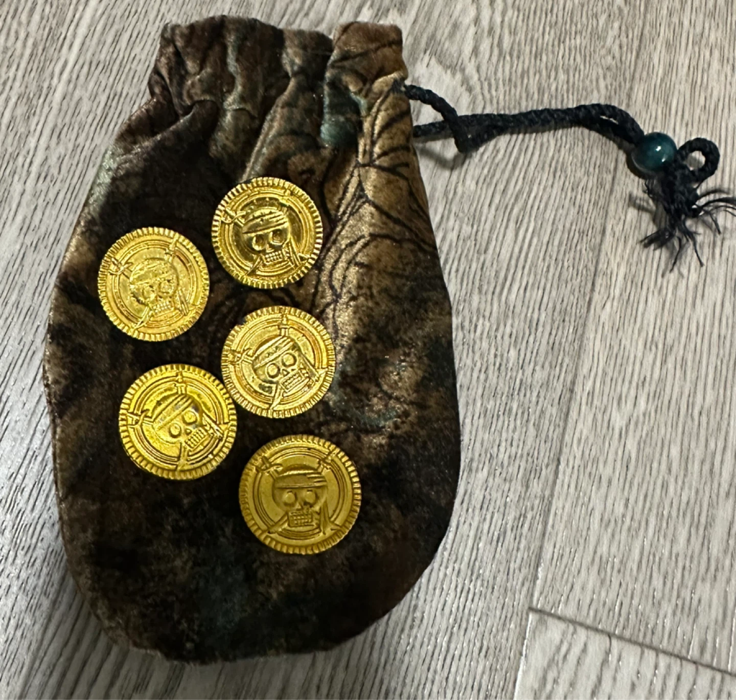 Pirate doubloons in a velvet pouch