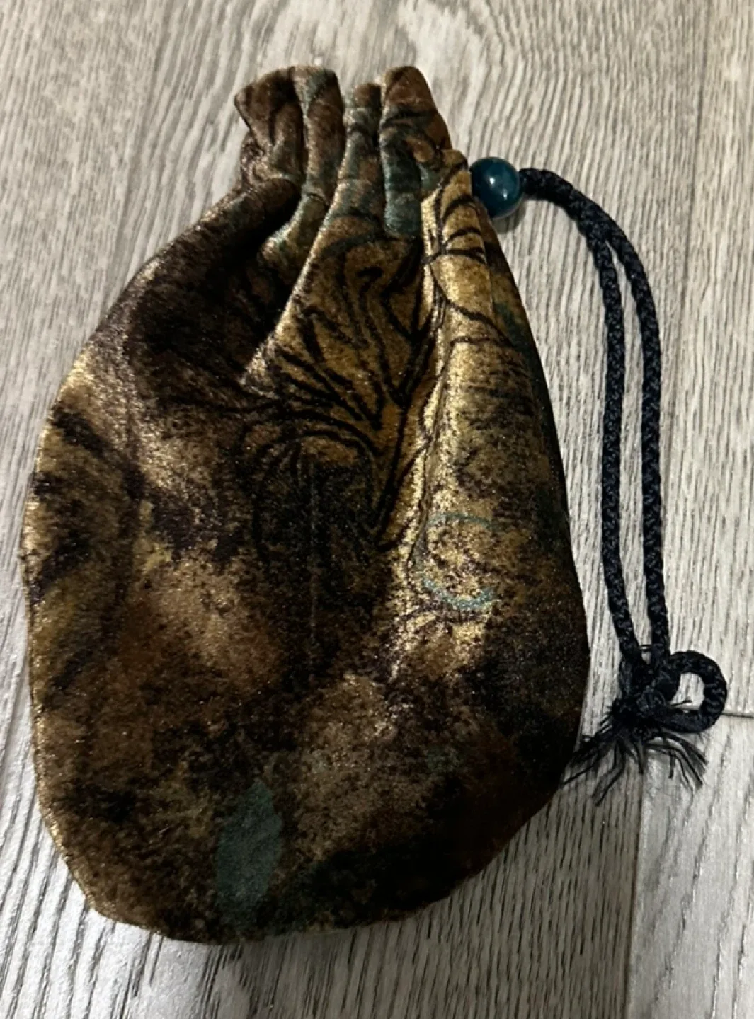 Pirate doubloons in a velvet pouch image indicator(3)