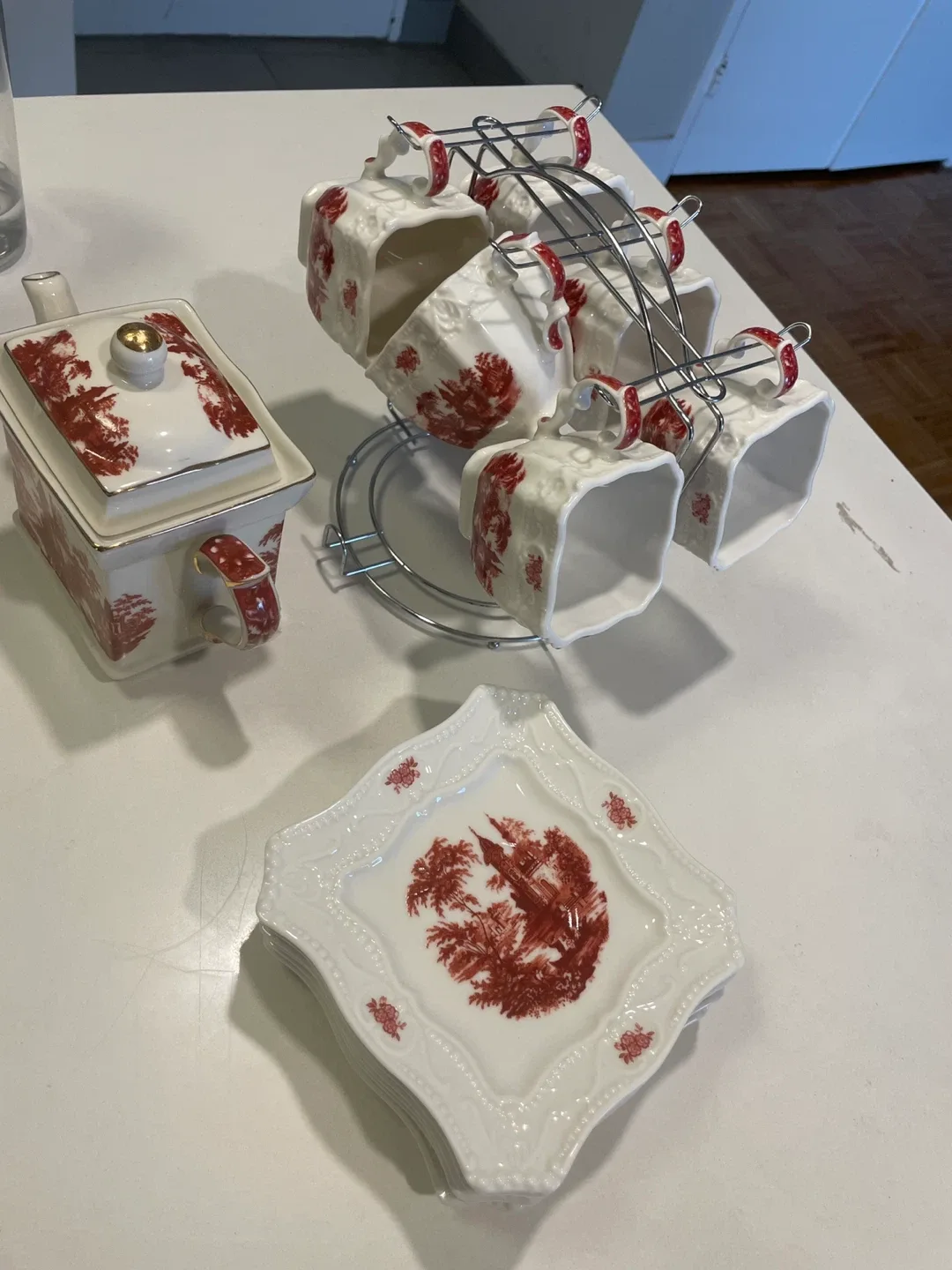 Vintage Tea Set with Teapot, Cups, and Plates image indicator(7)