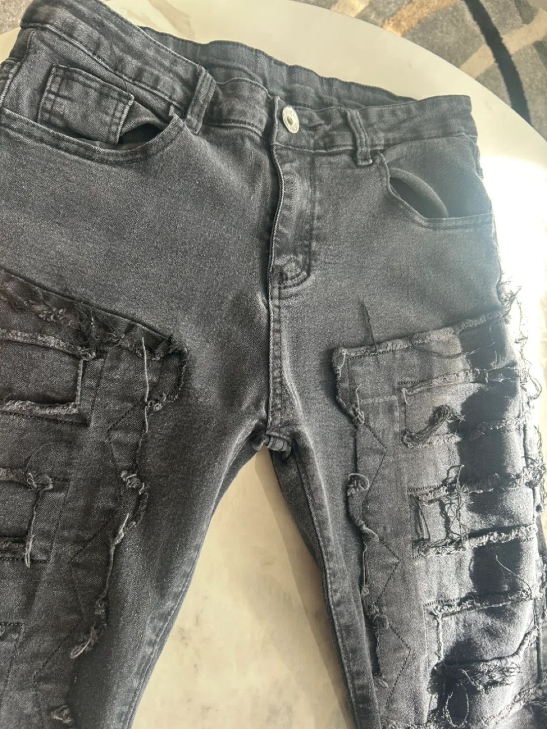 Distressed stacked Black Jeans image indicator(2)