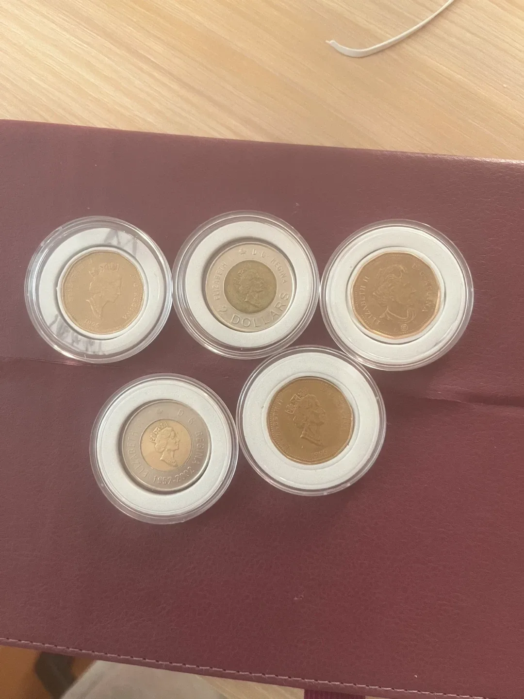 Canadian commemorative toonies and loonies details below image indicator(2)