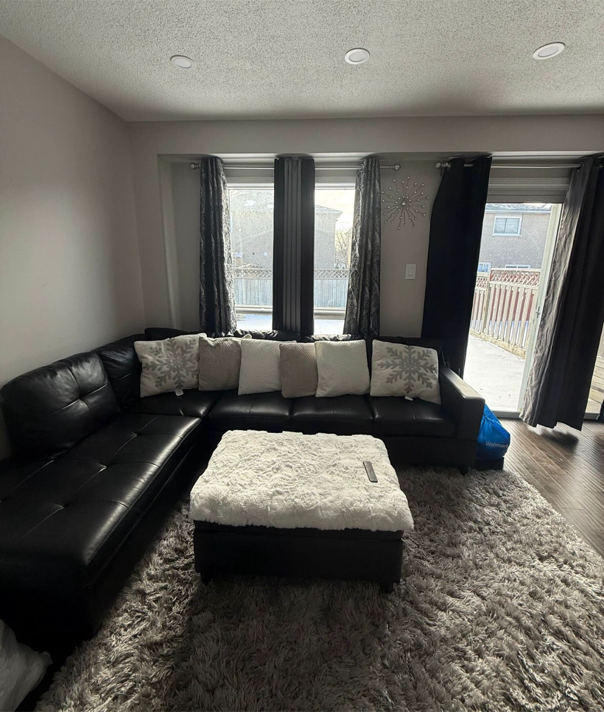 Black Leather Sectional Sofa with Ottoman