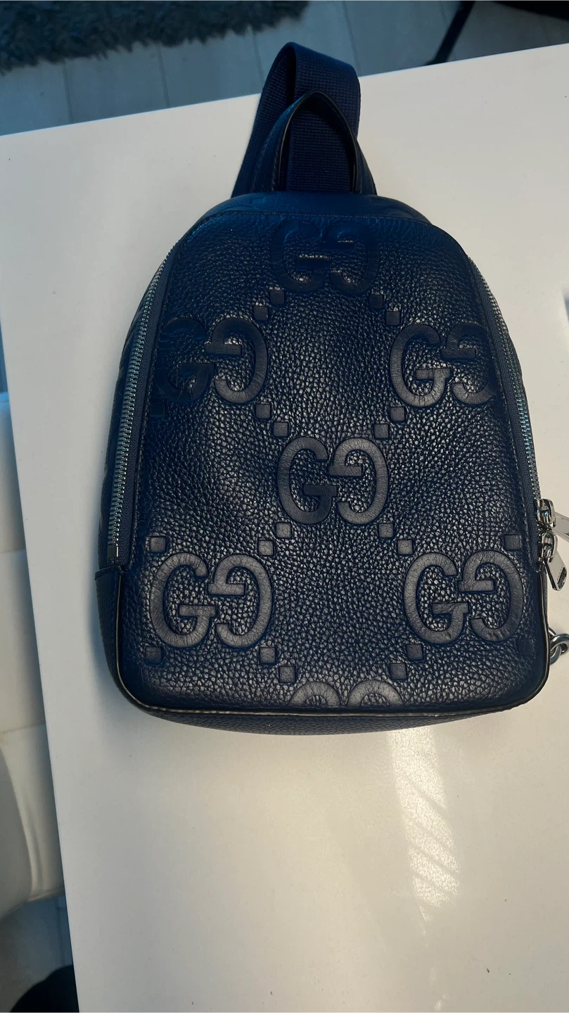 Gucci Embossed Leather Sling Backpack