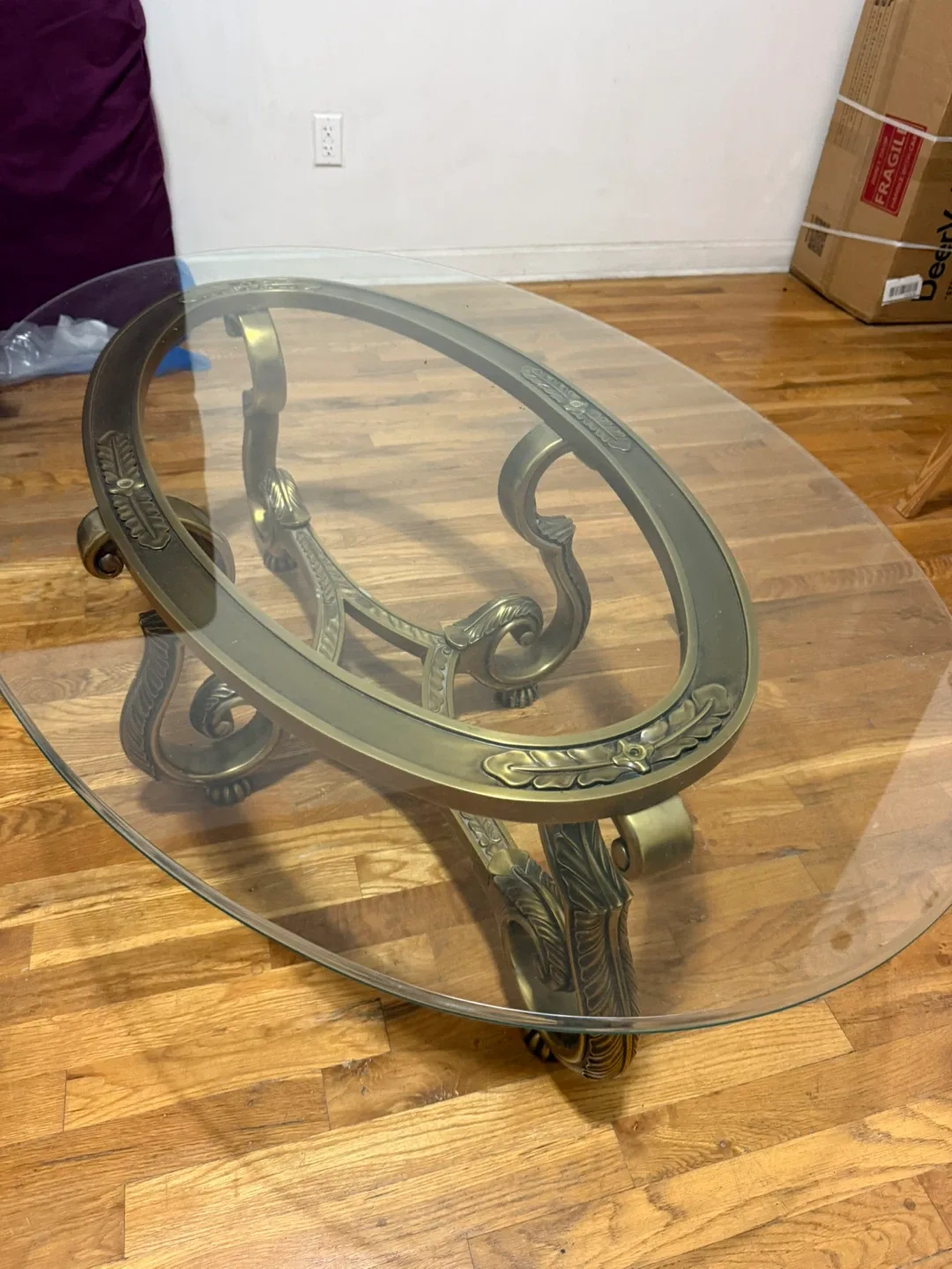Oval Glass Coffee Table with Ornate Bronze Base image indicator(5)