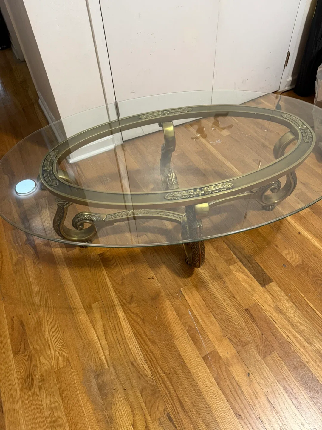 Oval Glass Coffee Table with Ornate Bronze Base image indicator(3)