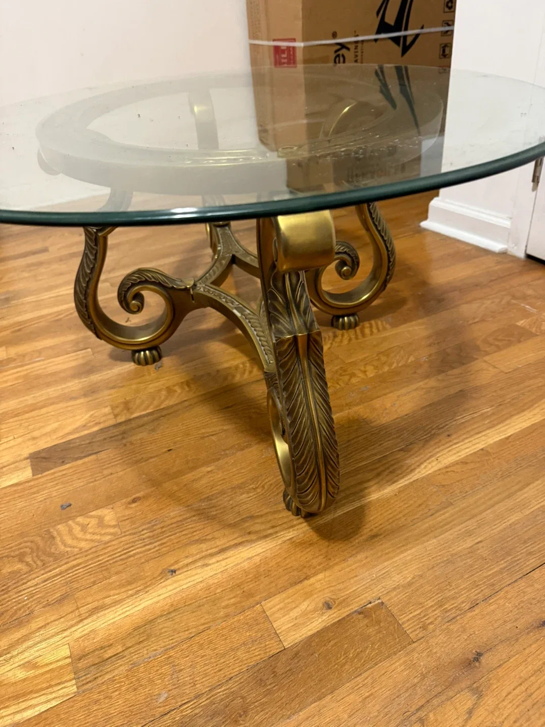 Oval Glass Coffee Table with Ornate Bronze Base image indicator(2)