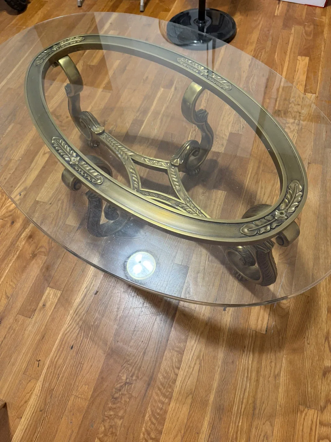 Oval Glass Coffee Table with Ornate Bronze Base image indicator(4)