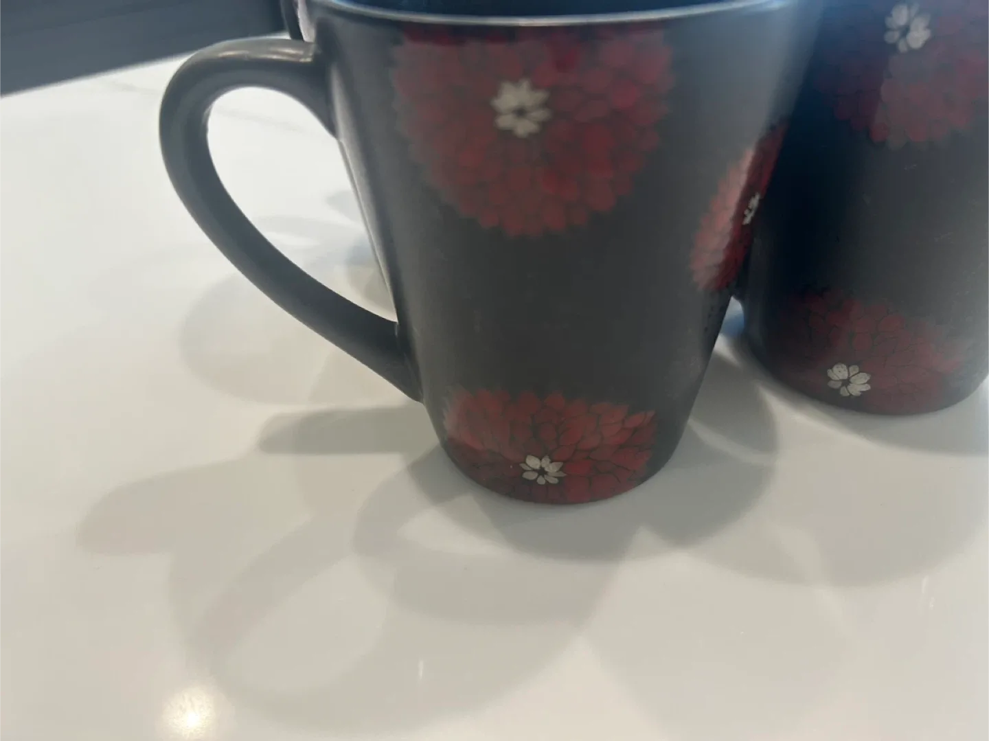 Set of 4 Black mugs with lotus flowers image indicator(2)