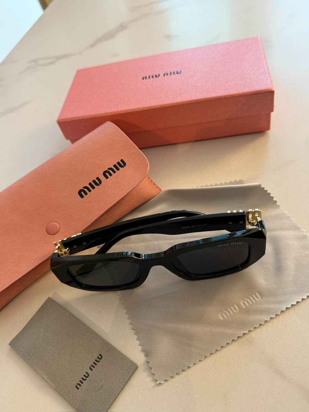 Miu Miu Sunglasses ($70)