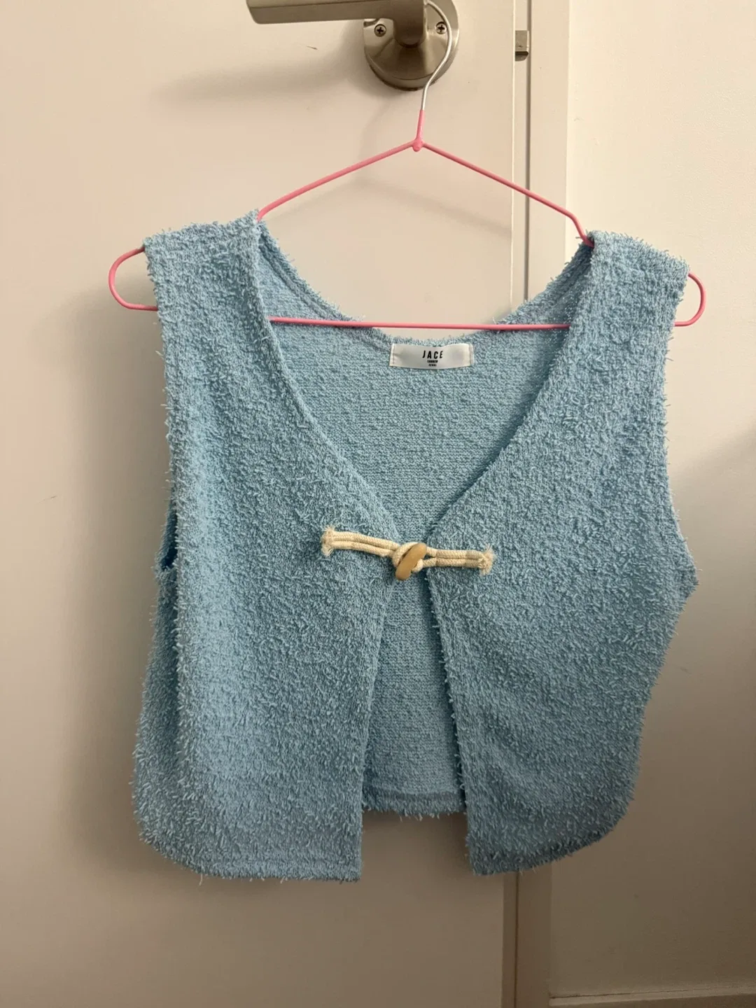 Blue knit vest thumbnail