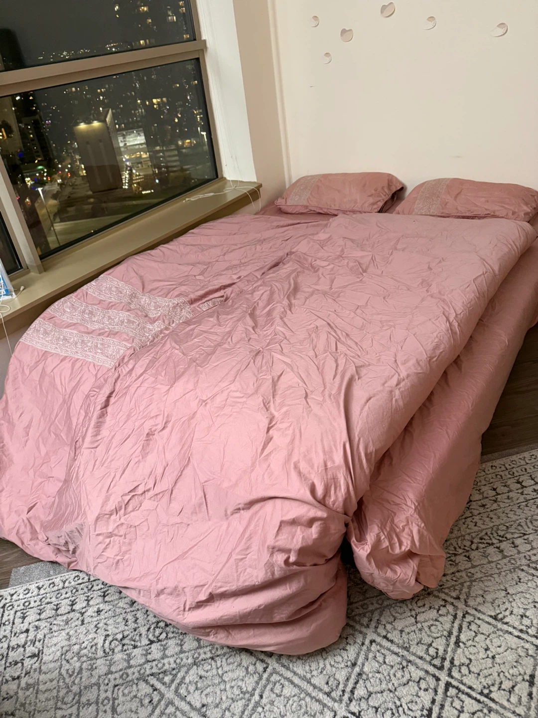 Mattress with pillows, bedsheets and quilt