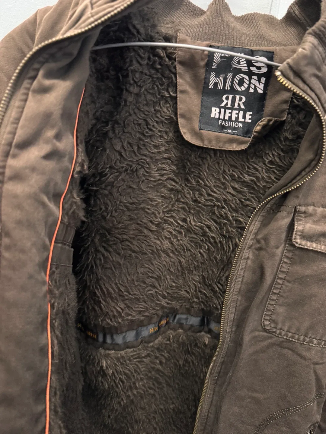 Brown jacket with faux-shearling lining for warmth image indicator(2)