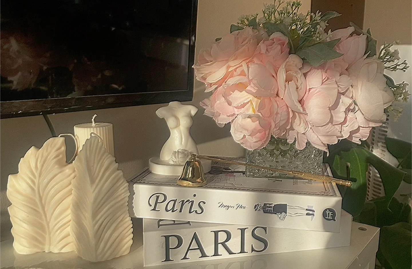 Home Decor: Candles, Books, Statue, and Flowers