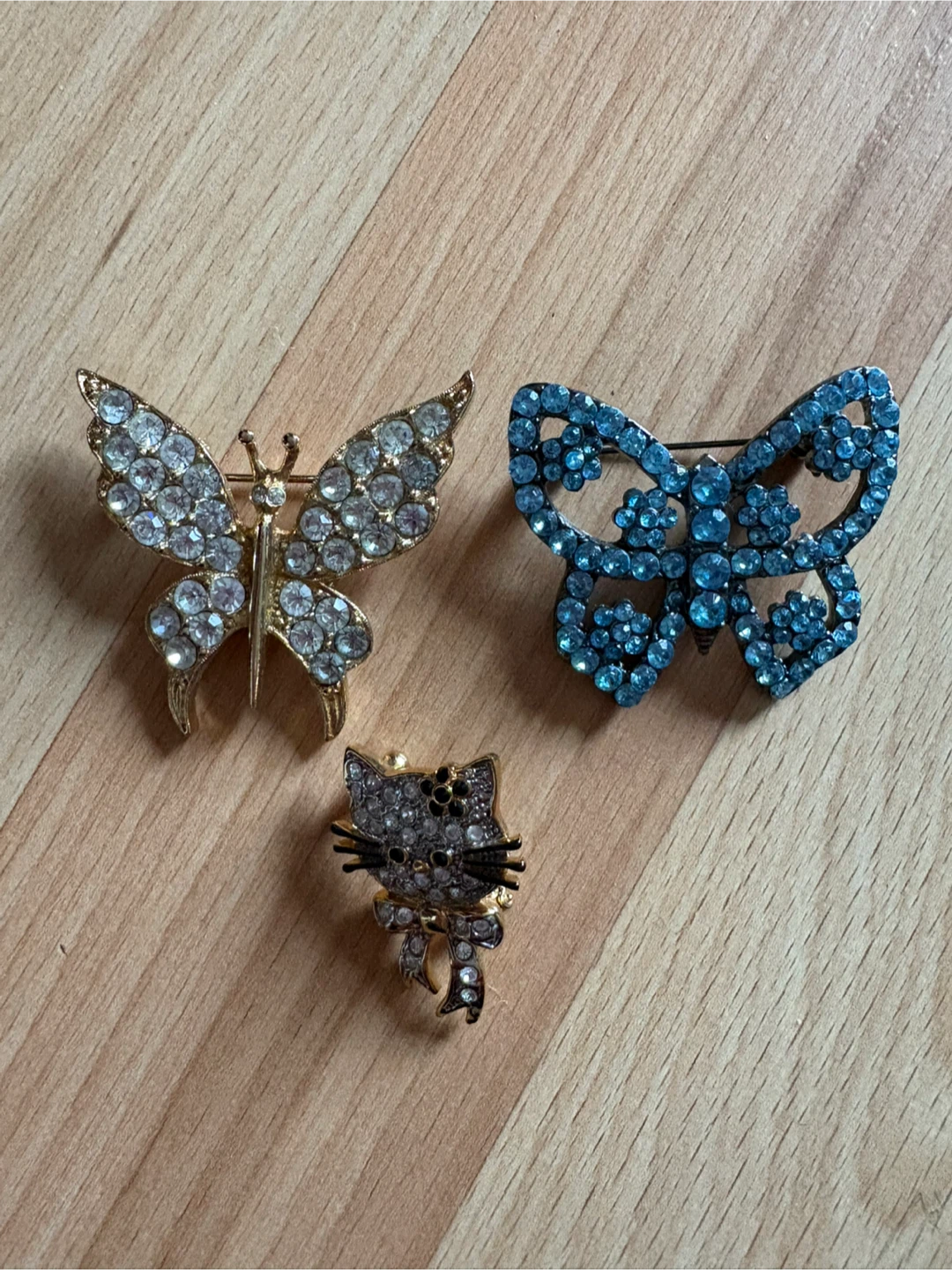 Brooches $5 each firm