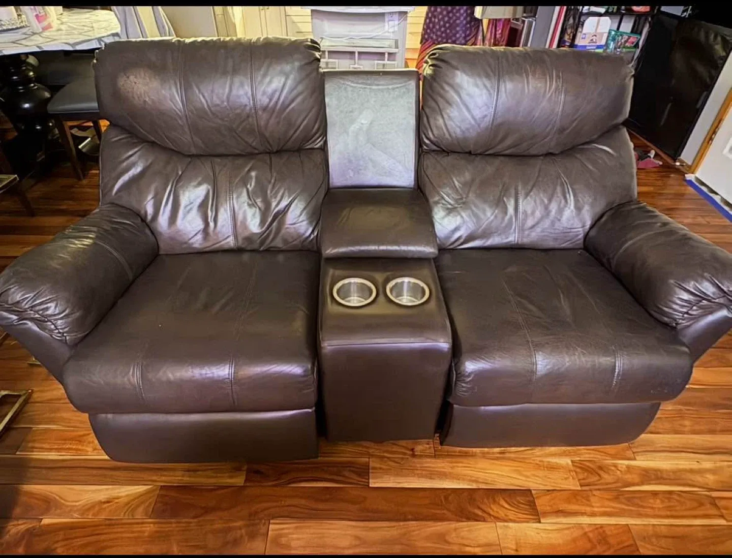 Brown Leather powered Reclining Loveseat with Console